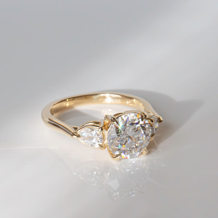 Lab Grown Diamond Three Stone Engagement Ring with Round Center & Pear Side Diamonds in 14K Gold